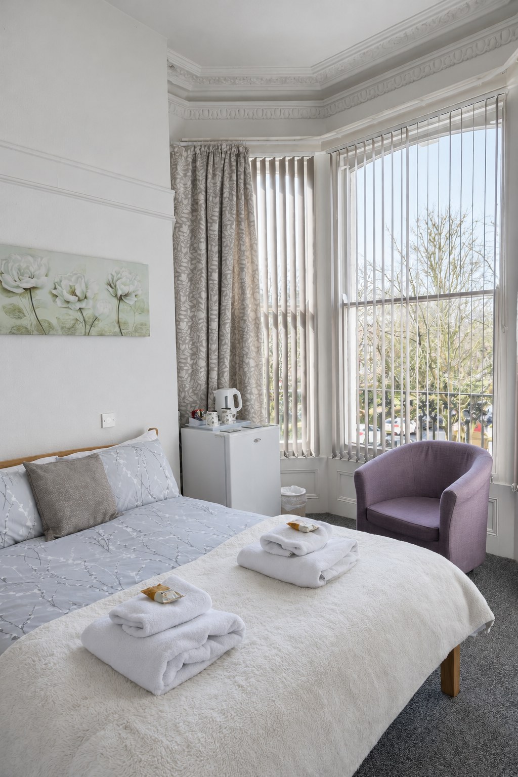 Carlton House — bright bay-window room